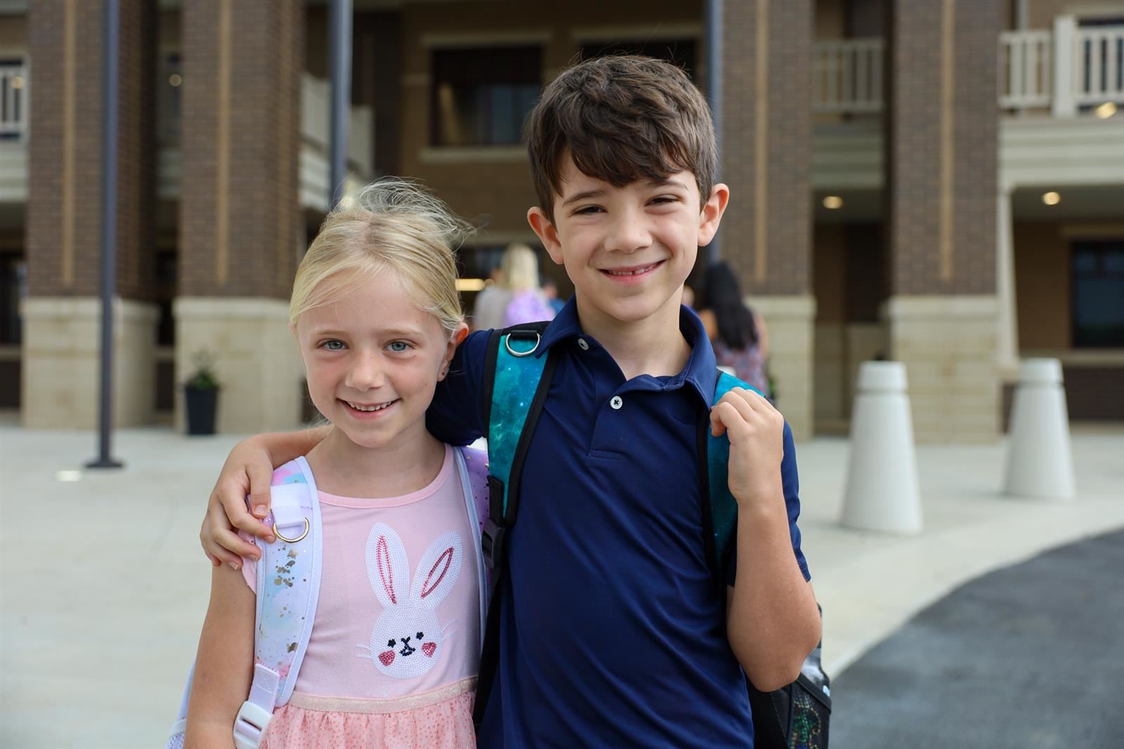 two students in front of ARES